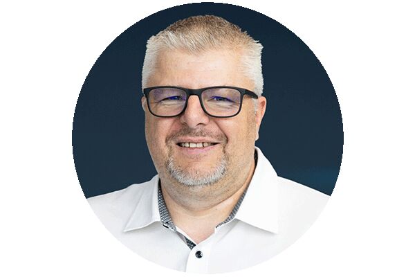 Headshot of Thomas Weiss, Safety Engineer at Festo, smiling into the camera.